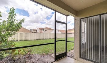 Screened In Patio with Lawn Views at Water's Edge Apartments, Sunrise, FL